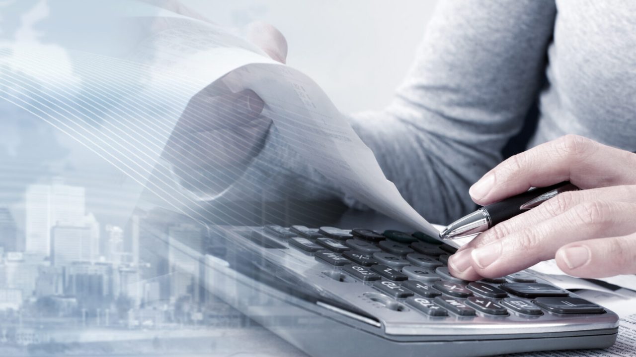 Bookkeeper hands working in office with calculator