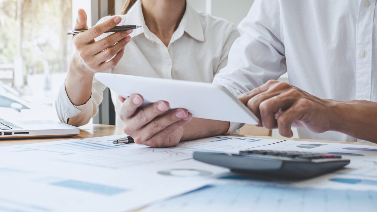 Two business colleague meeting to brainstorm the new project business strategy plan and analysis data document, finance and accounting concept Briefing, brainstorming, consulting.